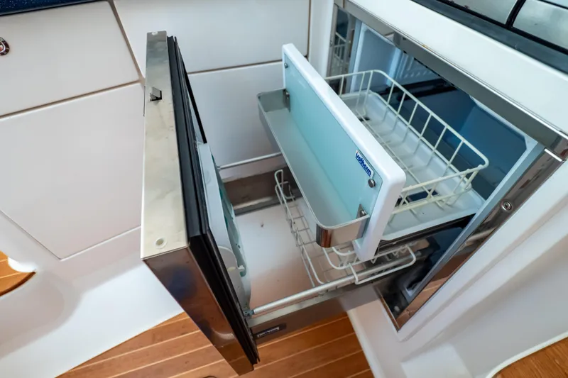 Slide: The Image of Open drawer refrigerator in 2014 Intrepid 375 Walkaround boat kitchen. - 43