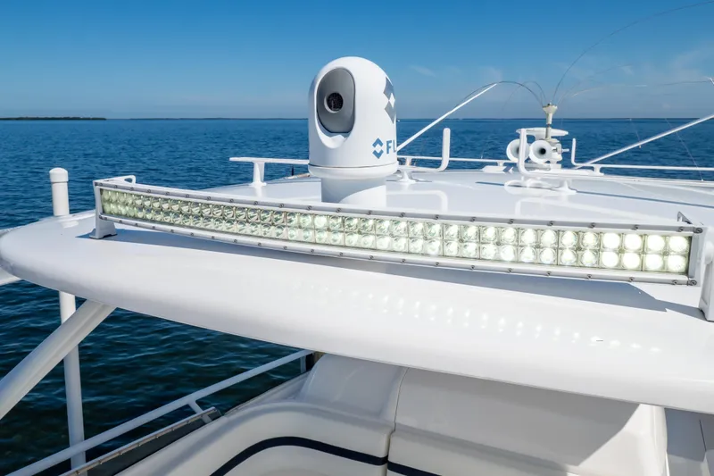 Slide: The Image of 2014 Intrepid 375 Walkaround boat with advanced lighting and radar system on open water. - 45