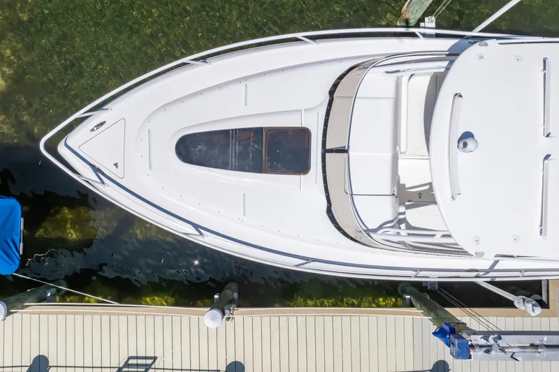 Slide: The Image of Overhead view of a 2014 Intrepid 375 Walkaround boat docked by a pier. - 47