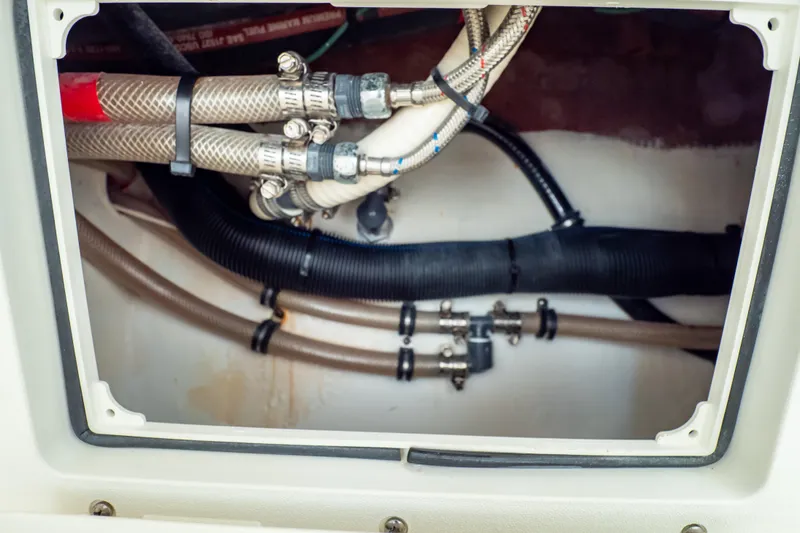 Slide: The Image of 2014 Intrepid 375 Walkaround boat plumbing system with hoses and connectors. - 49