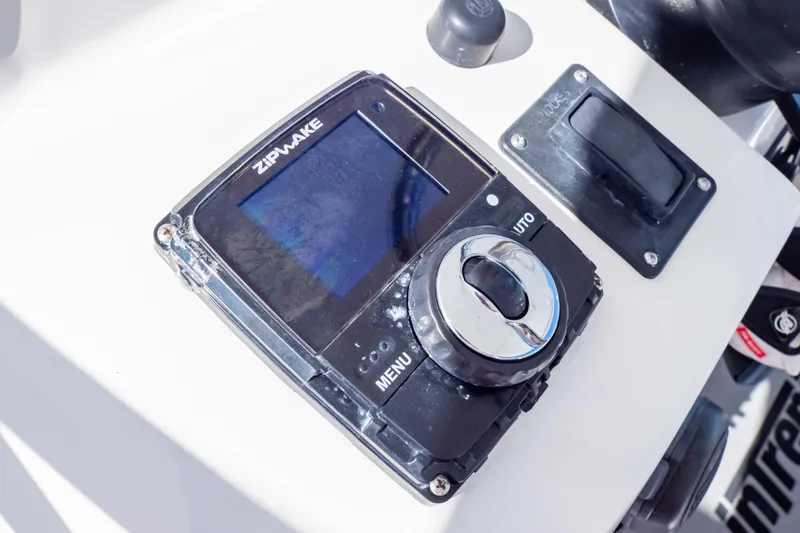 Slide: The Image of Control panel on 2014 Intrepid 375 Walkaround boat, featuring Zipwake system. - 55