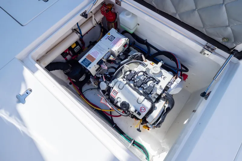 Slide: The Image of Engine compartment of a 2014 Intrepid 375 Walkaround boat, showcasing mechanical components. - 56