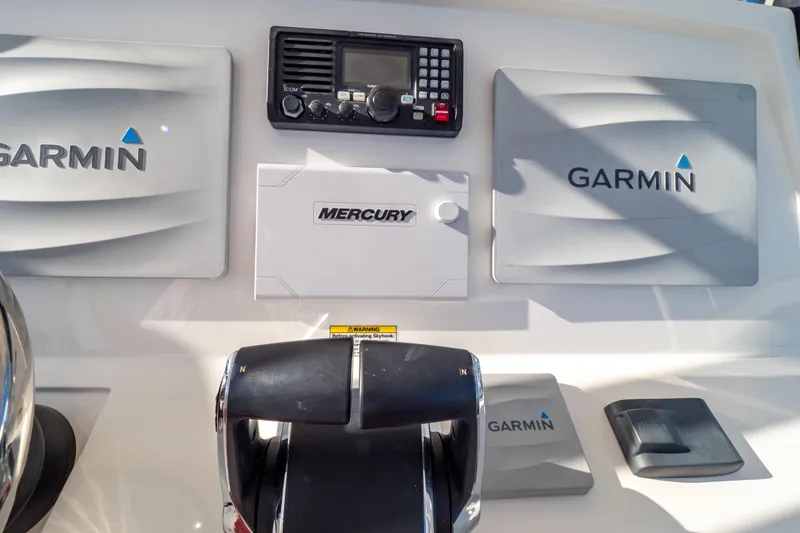 Slide: The Image of Control panel of a 2014 Intrepid 375 Walkaround with Garmin and Mercury equipment. - 58