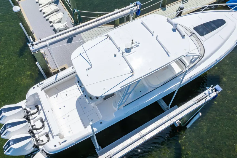 Slide: The Image of Aerial view of 2014 Intrepid 375 Walkaround boat docked at a marina. - 6