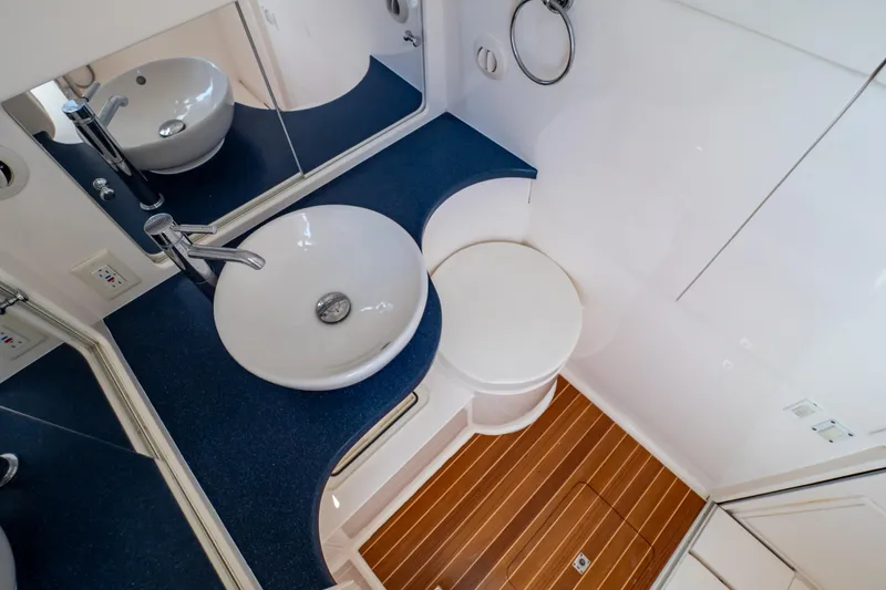 Slide: The Image of 2014 Intrepid 375 Walkaround bathroom with modern sink and wooden floor. - 61