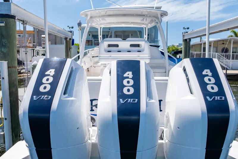 Slide: The Image of 2014 Intrepid 375 Walkaround with triple 400 V10 engines docked at marina. - 69