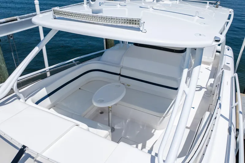 Slide: The Image of 2014 Intrepid 375 Walkaround boat with spacious seating and sleek design. - 76