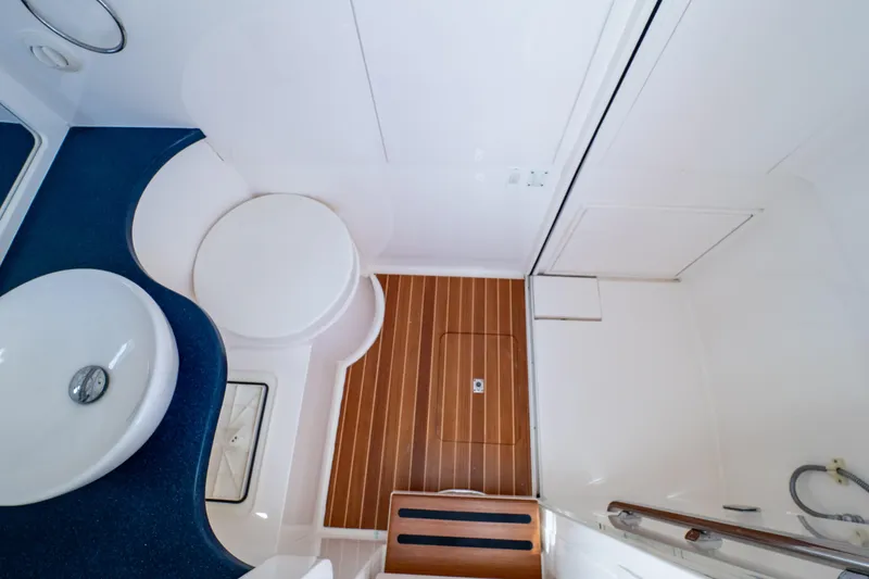 Slide: The Image of 2014 Intrepid 375 Walkaround bathroom with modern sink and wooden flooring. - 80