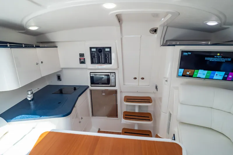 Slide: The Image of Interior of 2014 Intrepid 375 Walkaround with modern kitchen and entertainment area. - 81