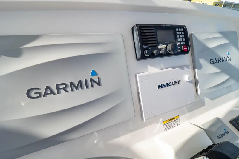 Slide: The Image of Control panel of a 2014 Intrepid 375 Walkaround featuring Garmin and Mercury equipment. - 83