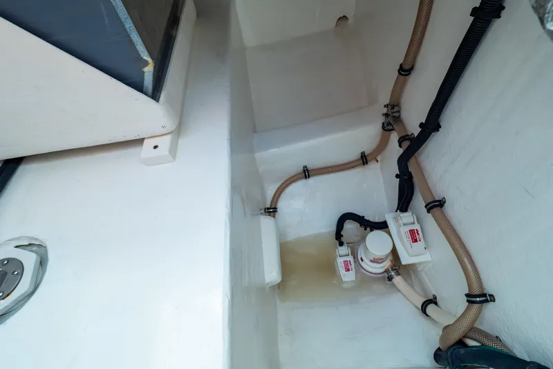 Slide: The Image of Bilge area of 2014 Intrepid 375 Walkaround with hoses and pump system. - 84