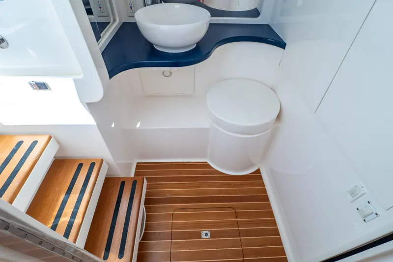 Slide: The Image of 2014 Intrepid 375 Walkaround bathroom with wooden flooring and modern fixtures. - 9