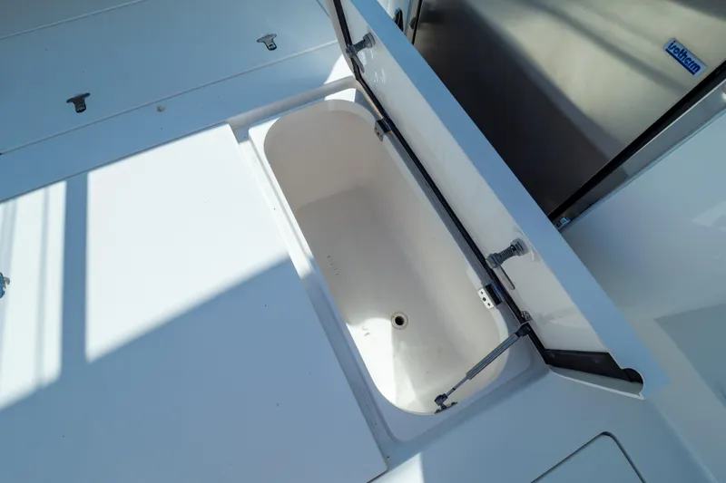 Slide: The Image of Open storage compartment on 2014 Intrepid 375 Walkaround boat, showcasing spacious interior. - 92