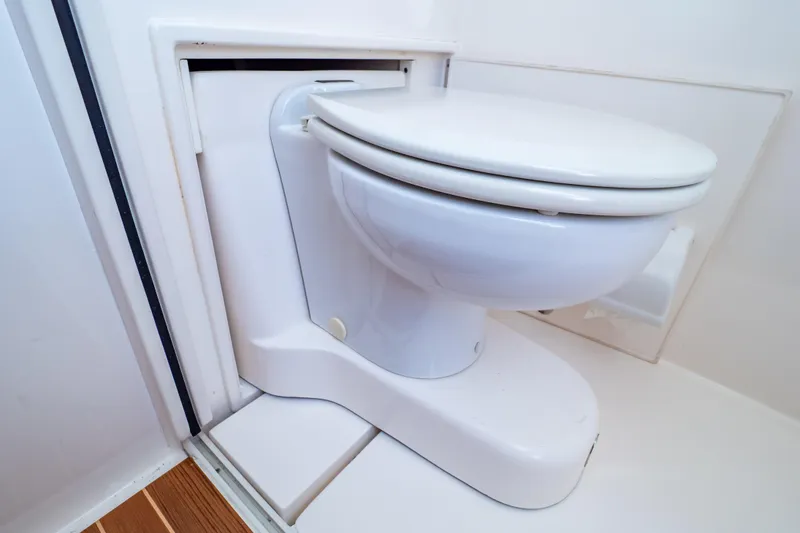 Slide: The Image of Toilet in 2014 Intrepid 375 Walkaround boat, featuring compact marine design. - 93