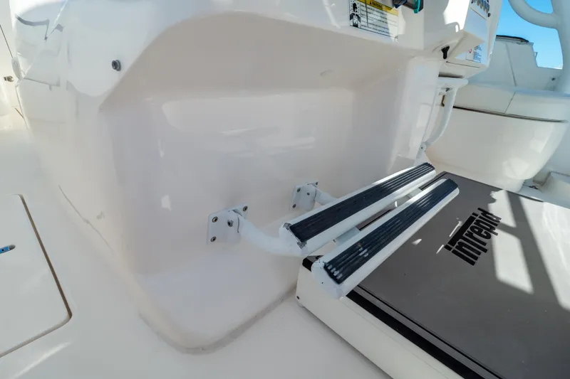 Slide: The Image of 2014 Intrepid 375 Walkaround boat steps and deck detail. - 95