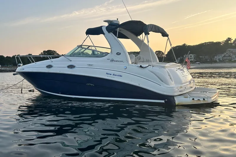 Slide: The Image of 2005 Sea Ray Sundancer 280 boat on calm water at sunset. - 4
