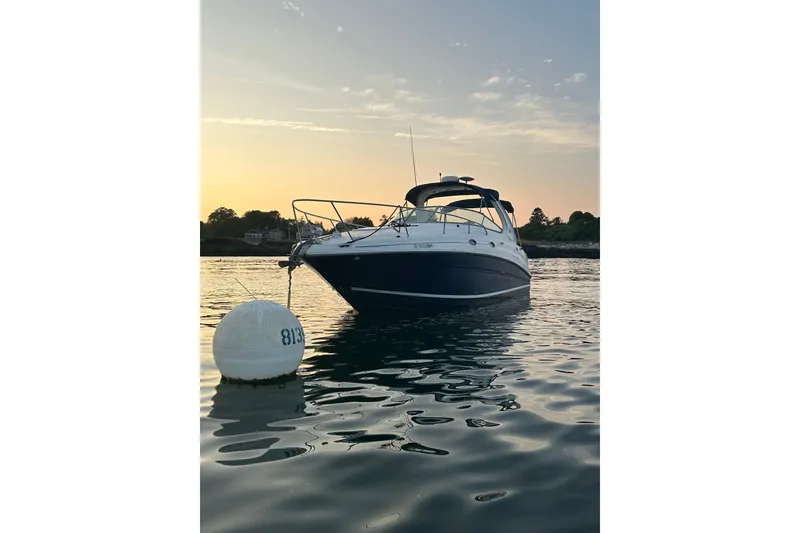 Slide: The Image of 2005 Sea Ray Sundancer 280 boat moored at sunset on calm water. - 7