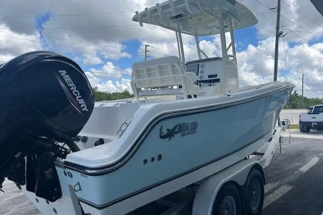 Slide: The Image of 2021 Mako 236 Center Console boat on trailer with Mercury outboard motor. - 3