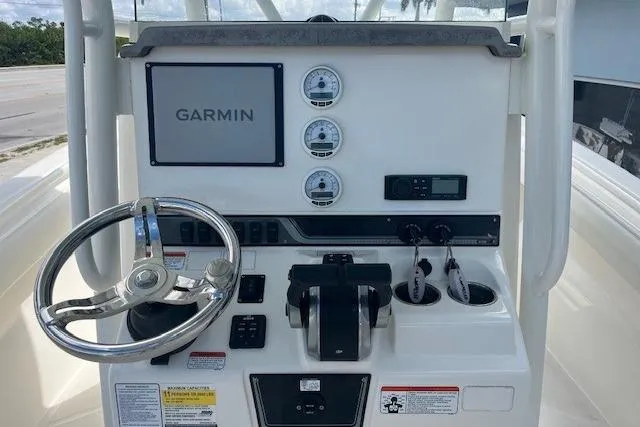Slide: The Image of Center console of 2021 Mako 236 with Garmin display and steering wheel. - 4