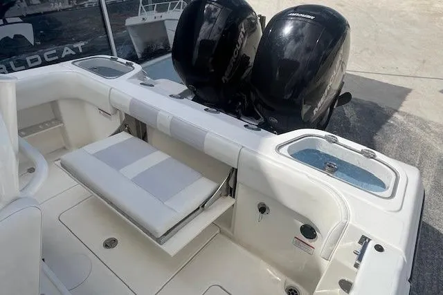 Slide: The Image of 2021 Mako 236 Center Console boat with dual outboard motors and seating area. - 8