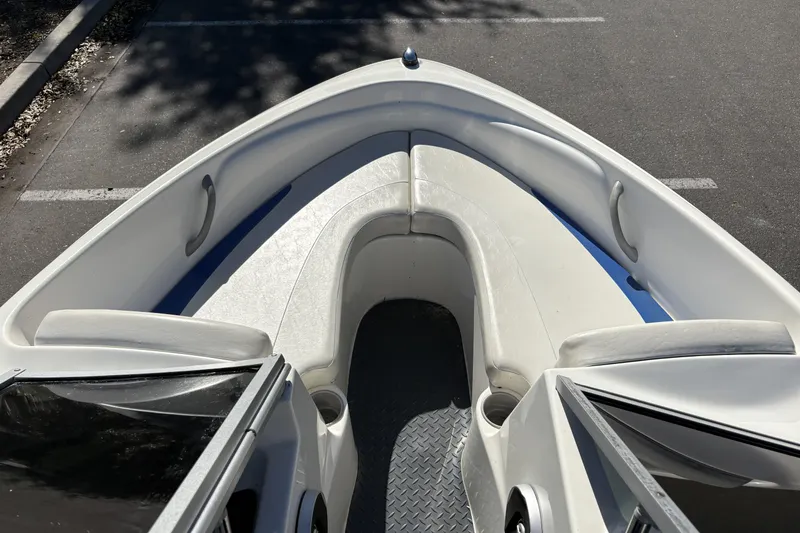 Slide: The Image of 2007 Bayliner 175 Bowrider interior with white seating and open bow design. - 14