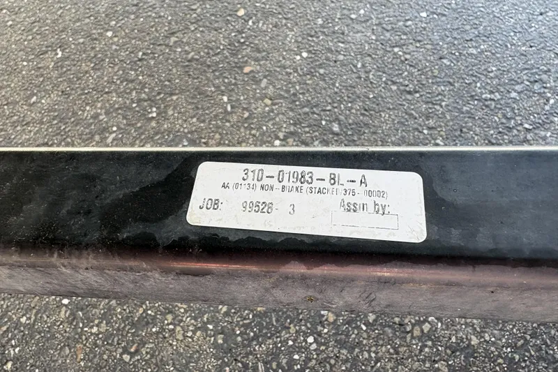 Slide: The Image of Label on a Bayliner 175 Bowrider 2007 boat trailer, showing job and assignment details. - 30