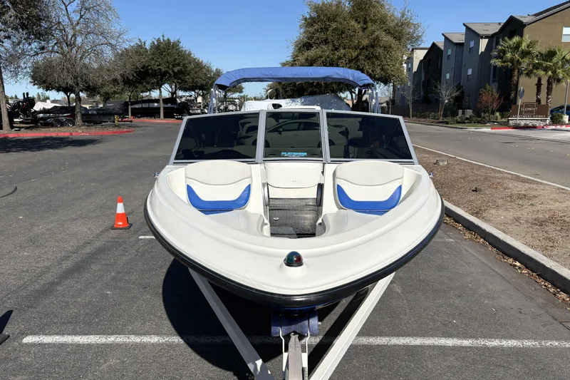 Slide: The Image of 2007 Bayliner 175 Bowrider parked on a street, showcasing its sleek design. - 5