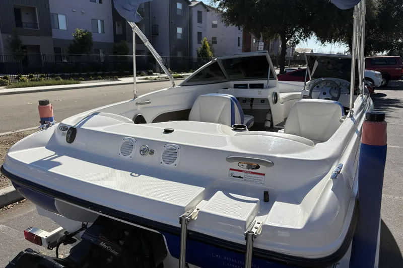 Slide: The Image of 2007 Bayliner 175 Bowrider boat parked, showcasing interior seating and dashboard. - 9