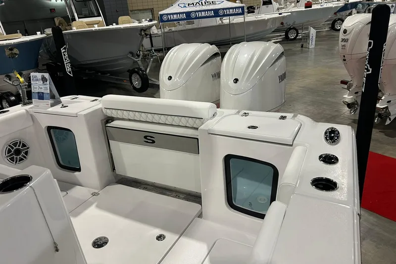 Slide: The Image of 2026 Sportsman Open 282 Center Console boat interior with Yamaha engines at a boat show. - 11