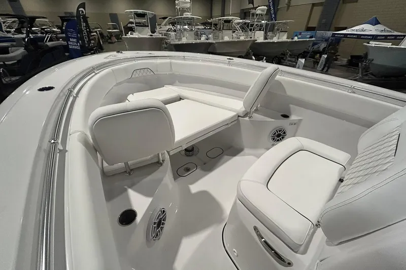 Slide: The Image of 2026 Sportsman Open 282 Center Console boat interior with white seating and modern design. - 3