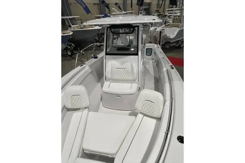 Slide: The Image of 2026 Sportsman Open 282 Center Console boat with sleek white seating and modern design. - 4