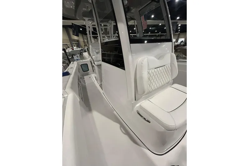 Slide: The Image of 2026 Sportsman Open 282 Center Console boat interior with sleek seating and modern design. - 5