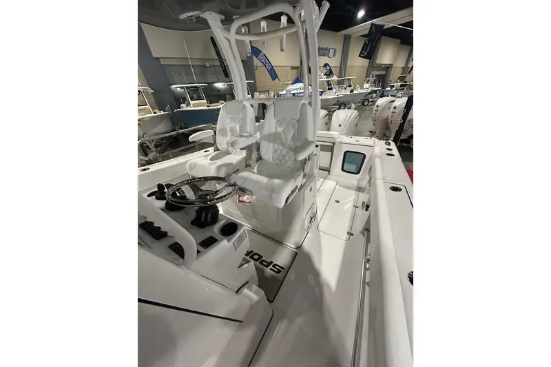 Slide: The Image of 2026 Sportsman Open 282 Center Console boat interior with dual seating and steering wheel. - 8