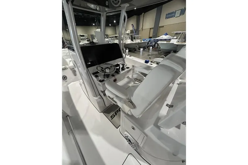Slide: The Image of 2026 Sportsman Open 282 Center Console boat interior at a showroom display. - 9