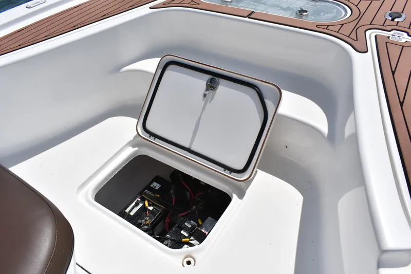 Slide: The Image of Open storage compartment on 2018 Sea Pro 248 Bay boat deck. - 16