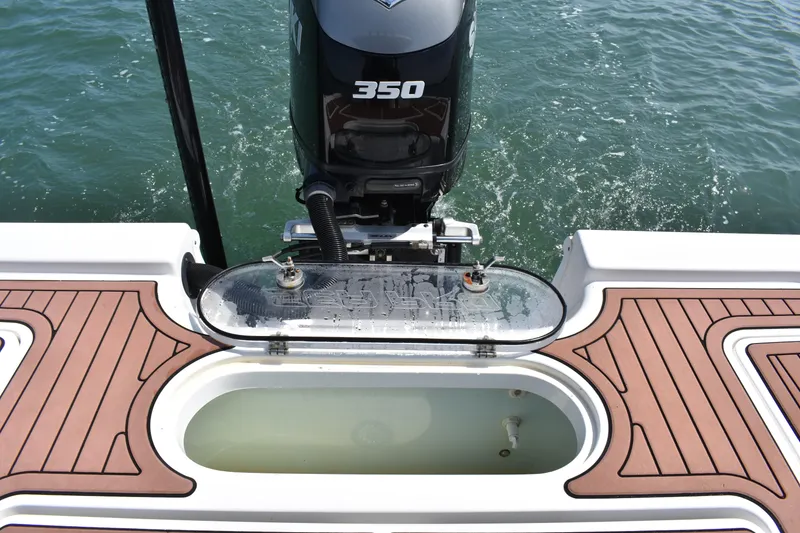 Slide: The Image of 2018 Sea Pro 248 Bay boat with 350 horsepower engine and livewell on deck. - 19