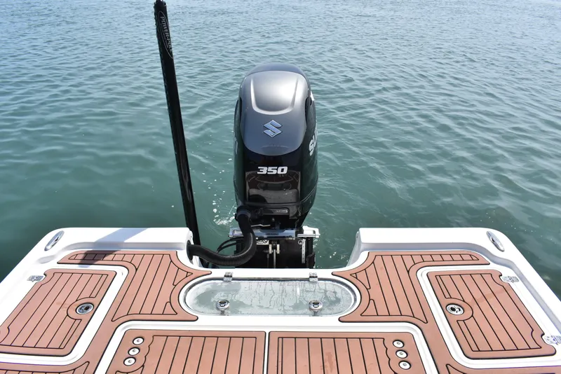 Slide: The Image of 2018 Sea Pro 248 Bay boat with Suzuki 350 outboard motor on calm water. - 22
