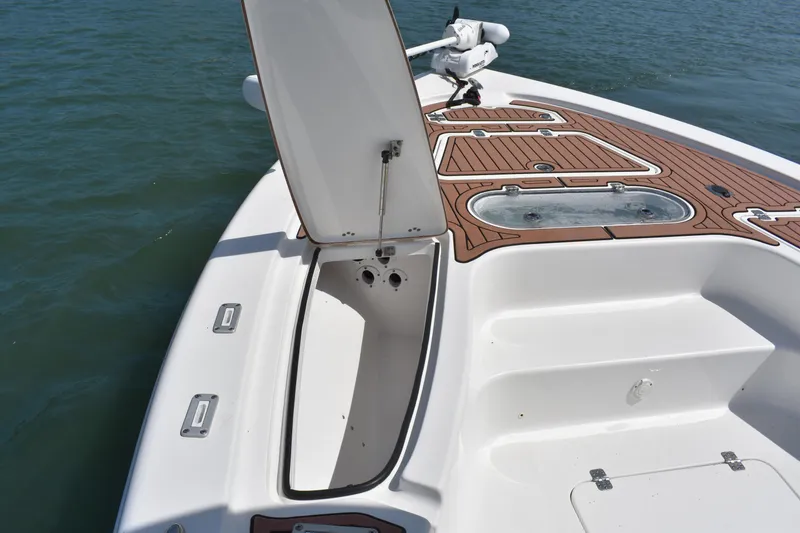 Slide: The Image of 2018 Sea Pro 248 Bay boat with open storage compartment on deck. - 7