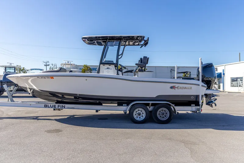 Slide: The Image of 2022 Crevalle 26 HCO boat on Blue Fin trailer in a parking lot. - 12