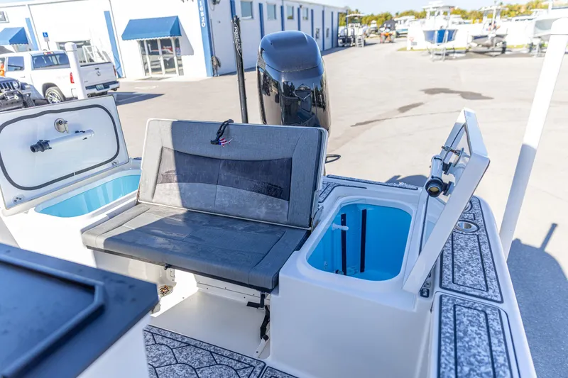 Slide: The Image of 2022 Crevalle 26 HCO boat interior with seating and storage compartments. - 5