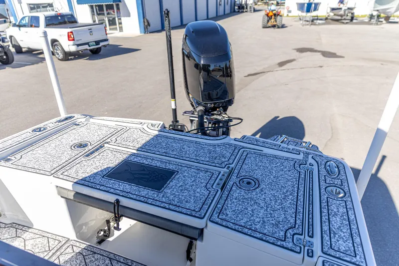 Slide: The Image of 2022 Crevalle 26 HCO boat with detailed deck design and powerful outboard motor. - 7