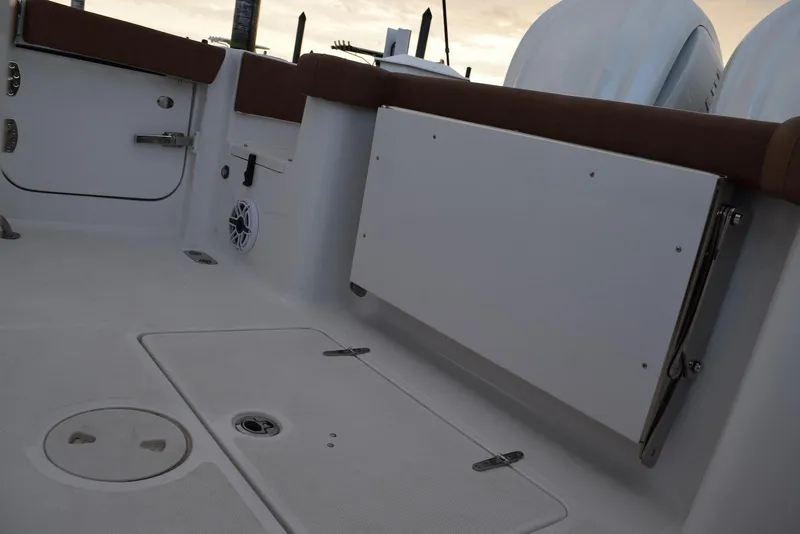 Slide: The Image of 2025 Sea Hunt Gamefish 28 Coffin Box interior with seating and storage compartments. - 11