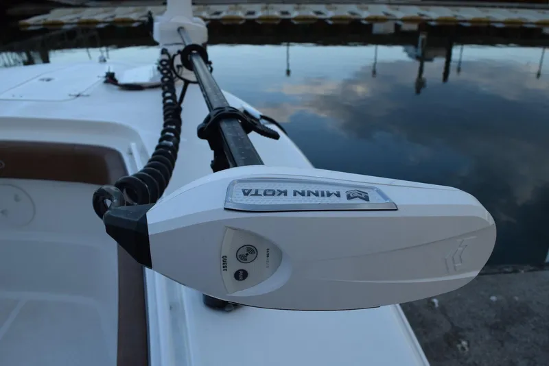 Slide: The Image of Minn Kota trolling motor on 2025 Sea Hunt Gamefish 28 Coffin Box boat by the water. - 15
