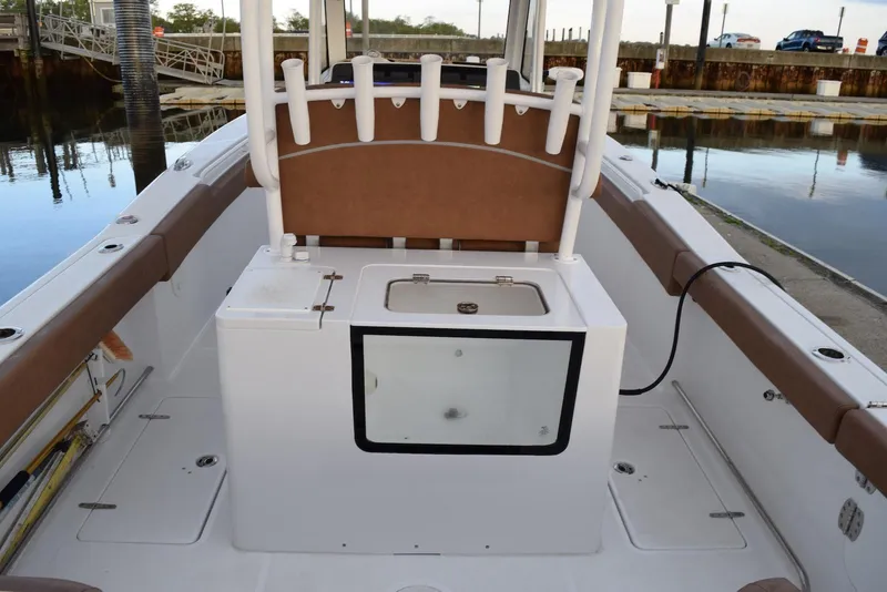 Slide: The Image of 2025 Sea Hunt Gamefish 28 Coffin Box boat interior with seating and storage. - 4