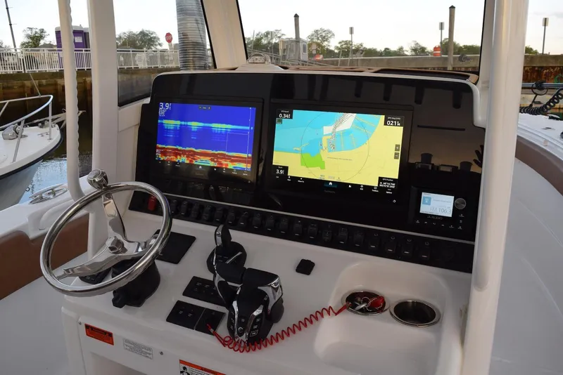Slide: The Image of 2025 Sea Hunt Gamefish 28 Coffin Box dashboard with advanced navigation and sonar displays. - 8