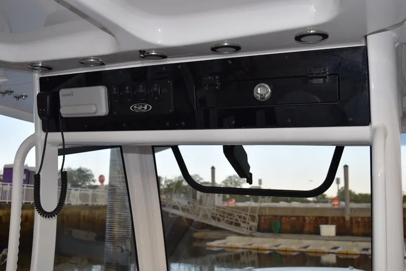 Slide: The Image of 2025 Sea Hunt Gamefish 28 Coffin Box boat console with Garmin electronics and control panel. - 9