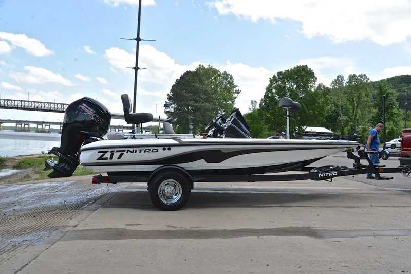 Slide: The Image of 2025 Nitro Z17 boat on trailer by riverside, ready for launch. - 14
