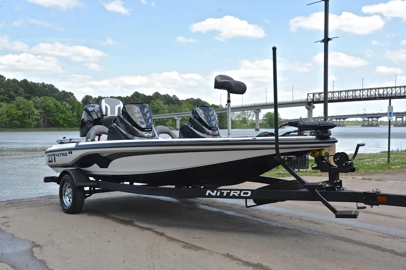 Slide: The Image of 2025 Nitro Z17 boat on trailer by a scenic riverside. - 15
