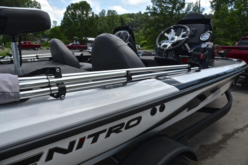 Slide: The Image of 2025 Nitro Z17 boat with sleek design and modern steering console, parked outdoors. - 18