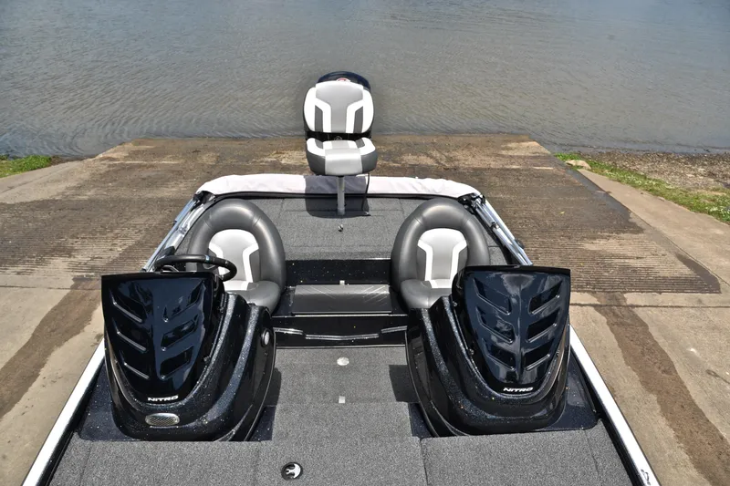 Slide: The Image of 2025 Nitro Z17 boat at a boat ramp, featuring sleek black and gray seating. - 20